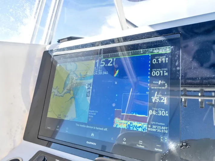  Yacht Photos Pics Garmin navigation display on a 2015 SeaHunter 45 boat showing GPS and sonar data.