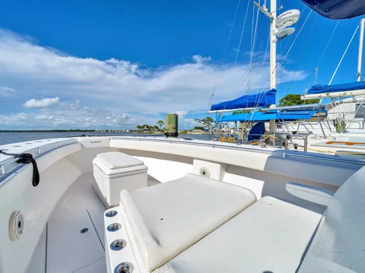 Yacht Photos Pics SeaHunter 45 (2015) boat deck with seating, docked under a clear blue sky.