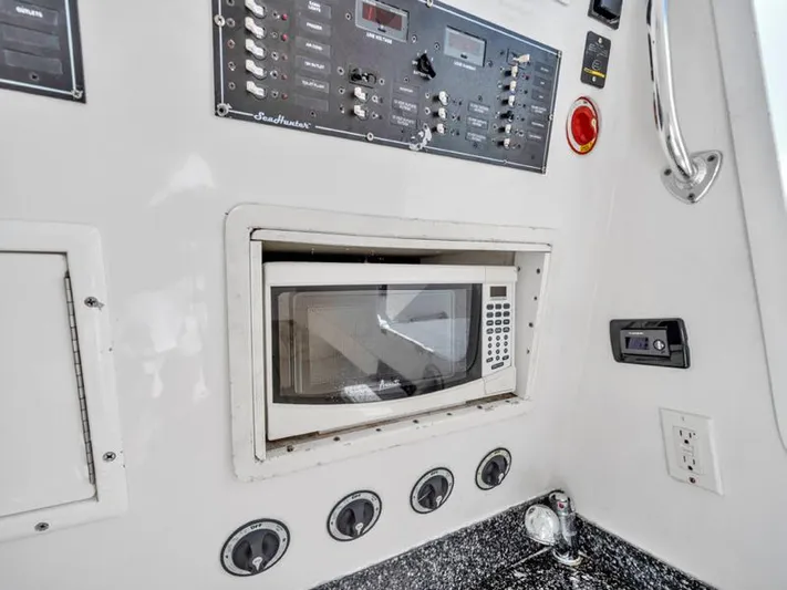  Yacht Photos Pics Built-in microwave and control panel on a 2015 SeaHunter 45 boat.