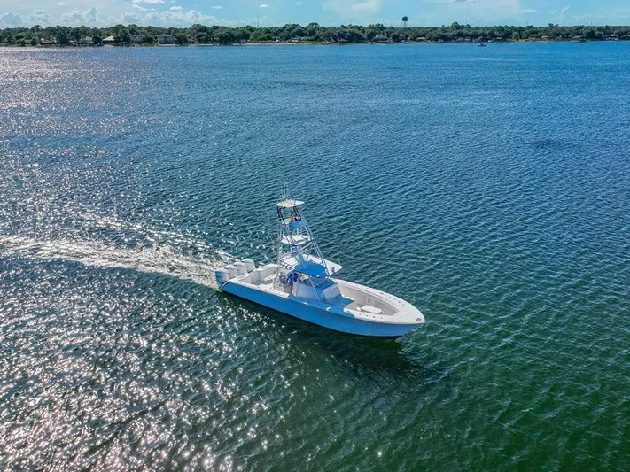  Yacht Photos Pics SeaHunter 45 boat cruising on open water, 2015 model, under clear blue sky.