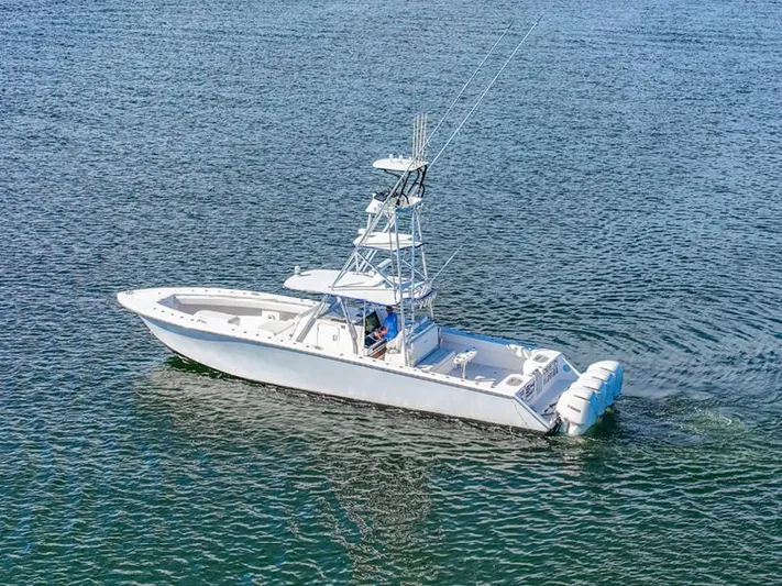  Yacht Photos Pics 2015 SeaHunter 45 boat cruising on open water, featuring multiple outboard engines.