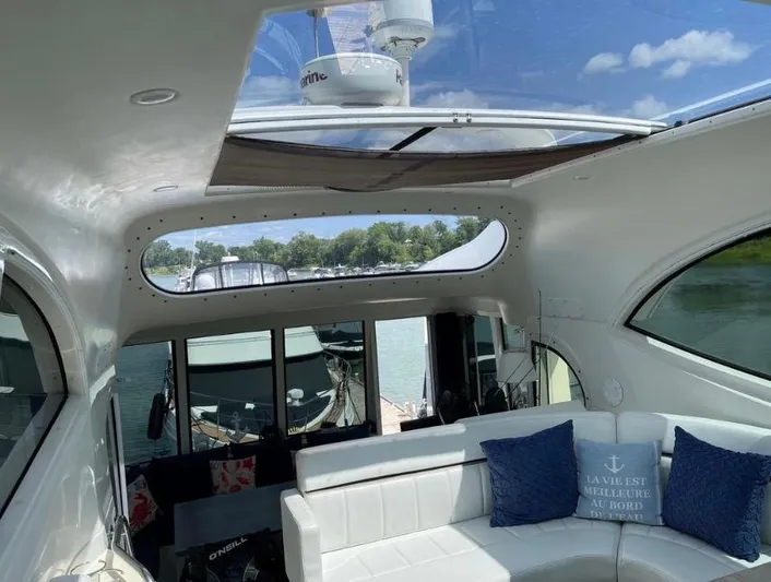  Yacht Photos Pics Interior view of 2000 Carver 506 Motor Yacht with white seating and skylight.