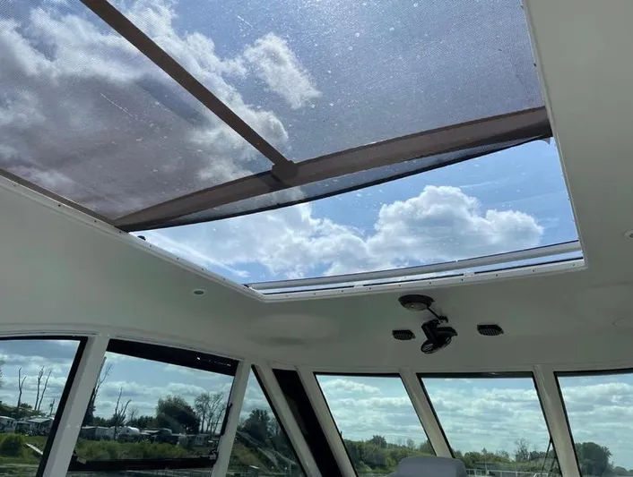  Yacht Photos Pics Skylight view from 2000 Carver 506 Motor Yacht, showcasing clear skies and clouds.