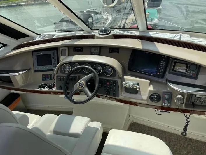  Yacht Photos Pics Helm of 2000 Carver 506 Motor Yacht with navigation instruments and steering wheel.