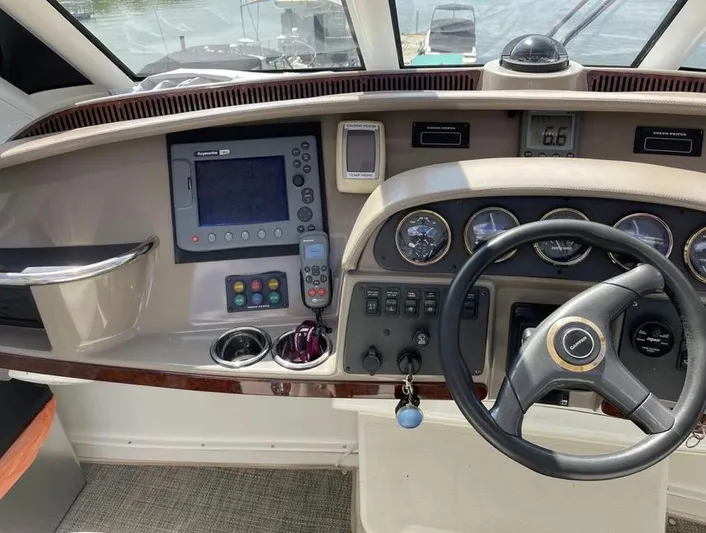  Yacht Photos Pics Helm of 2000 Carver 506 Motor Yacht with navigation instruments and steering wheel.