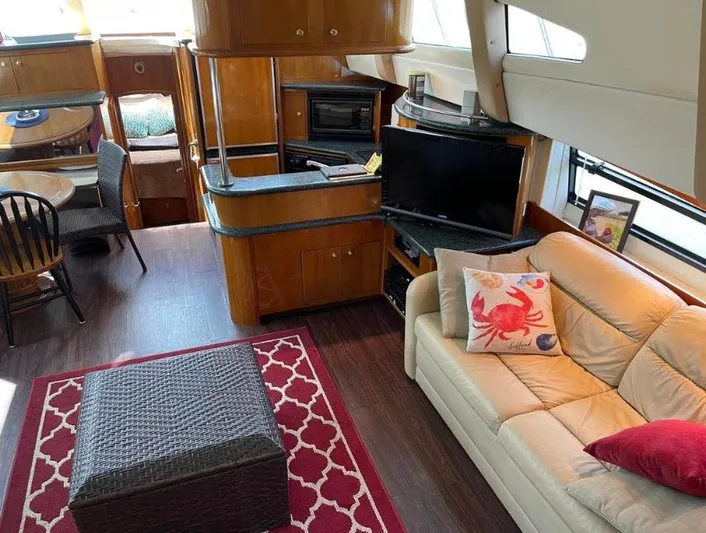  Yacht Photos Pics Interior of a 2000 Carver 506 Motor Yacht with cozy seating and elegant wood finishes.