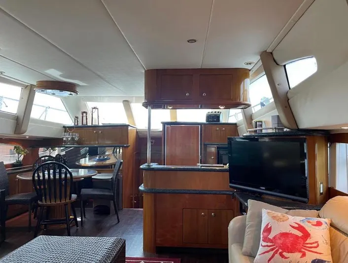  Yacht Photos Pics Interior of 2000 Carver 506 Motor Yacht with dining area and entertainment center.