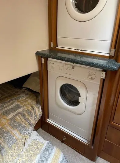  Yacht Photos Pics Laundry area in 2000 Carver 506 Motor Yacht with washer, dryer, and bedding.