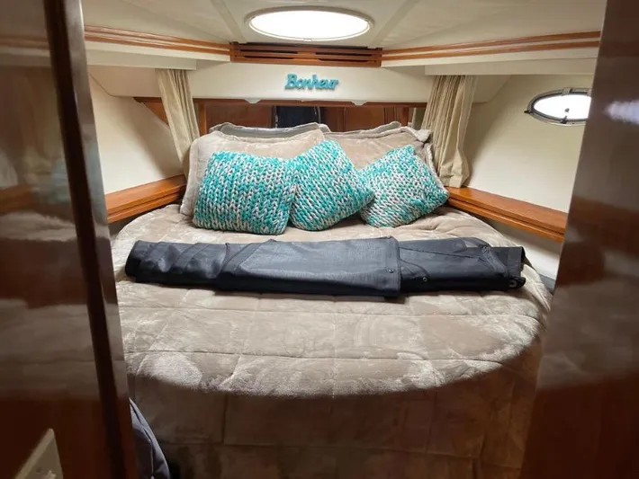  Yacht Photos Pics Luxurious bedroom in 2000 Carver 506 Motor Yacht with plush bedding and decorative pillows.