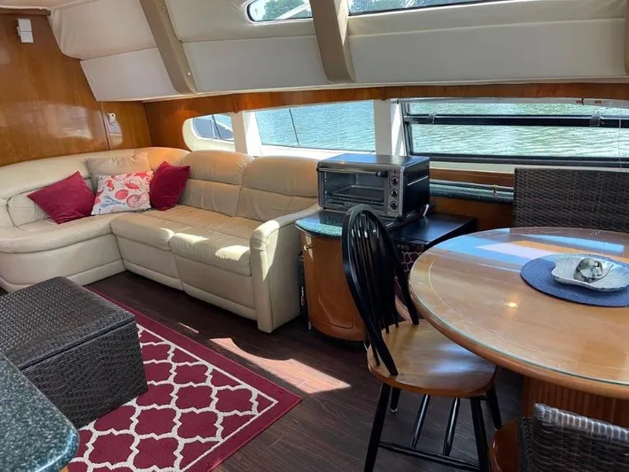  Yacht Photos Pics Interior of 2000 Carver 506 Motor Yacht with cozy seating and dining area.