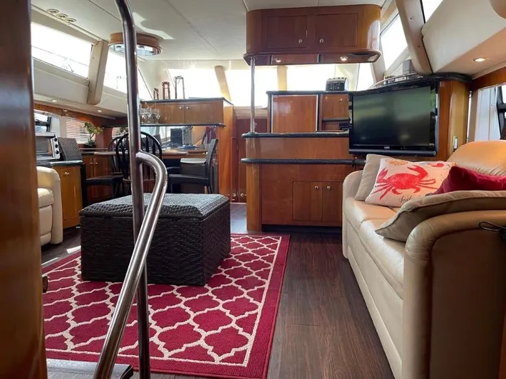  Yacht Photos Pics Interior of 2000 Carver 506 Motor Yacht with modern furnishings and red patterned rug.