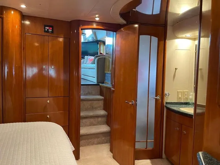  Yacht Photos Pics Interior of 2000 Carver 506 Motor Yacht with wood paneling and carpeted stairs.