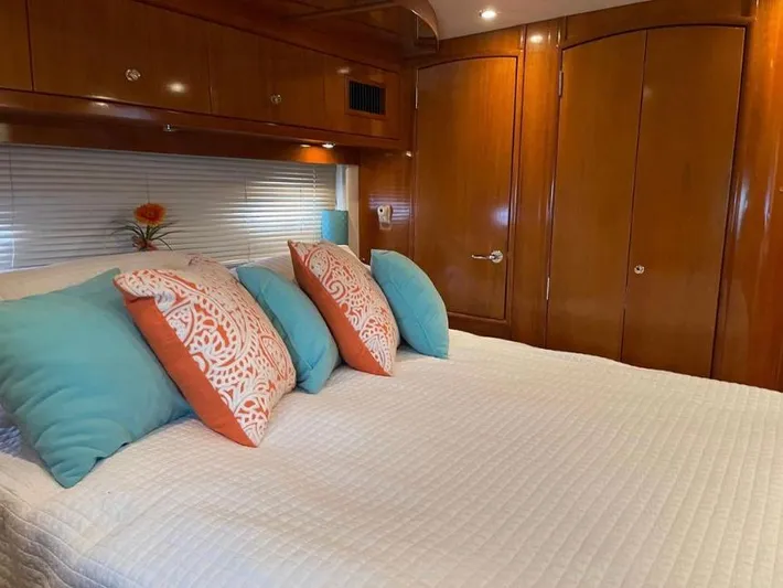  Yacht Photos Pics Luxurious bedroom interior of 2000 Carver 506 Motor Yacht with elegant wood finish.