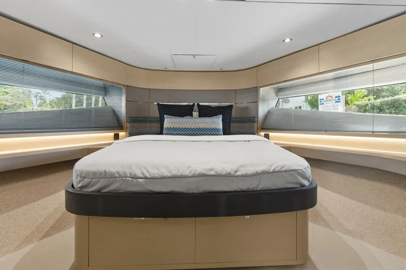 Above Deck Yacht Photos Pics Luxurious bedroom interior of 2018 Princess S60 yacht with modern design and large windows.