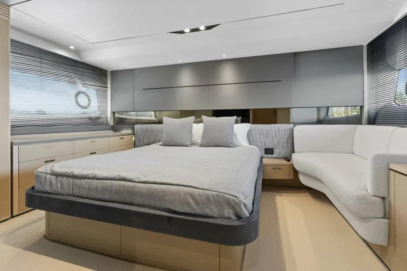 Above Deck Yacht Photos Pics Luxurious bedroom interior of 2018 Princess S60 yacht with modern design and elegant furnishings.