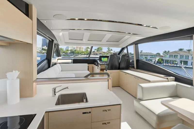 Above Deck Yacht Photos Pics Luxurious interior of 2018 Princess S60 yacht with modern kitchen and seating area.