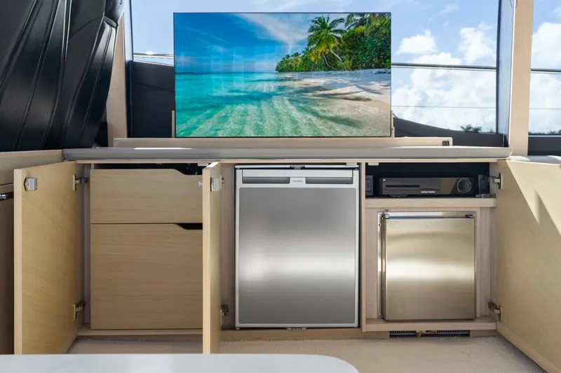 Above Deck Yacht Photos Pics Luxurious 2018 Princess S60 yacht interior with modern kitchen appliances and scenic ocean view.