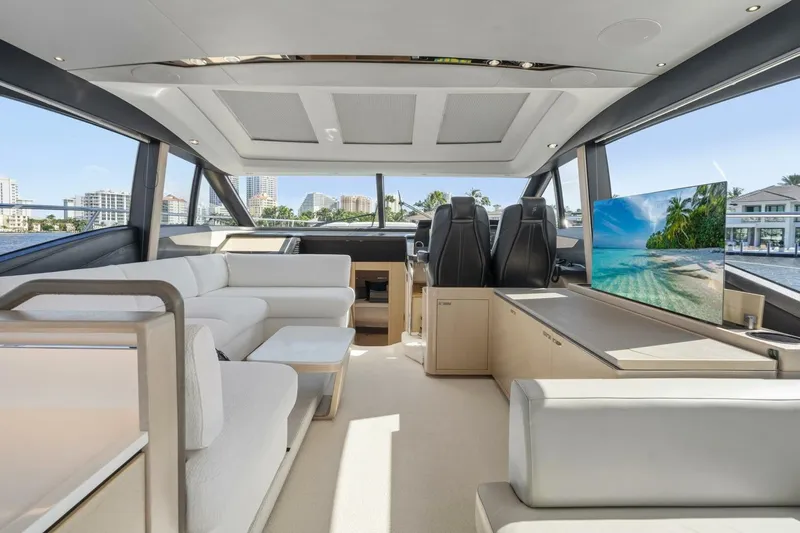Above Deck Yacht Photos Pics Luxurious interior of 2018 Princess S60 yacht with modern seating and large windows.