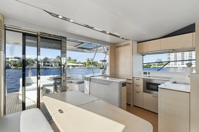 Above Deck Yacht Photos Pics Luxurious interior of 2018 Princess S60 yacht with modern kitchen and scenic water views.