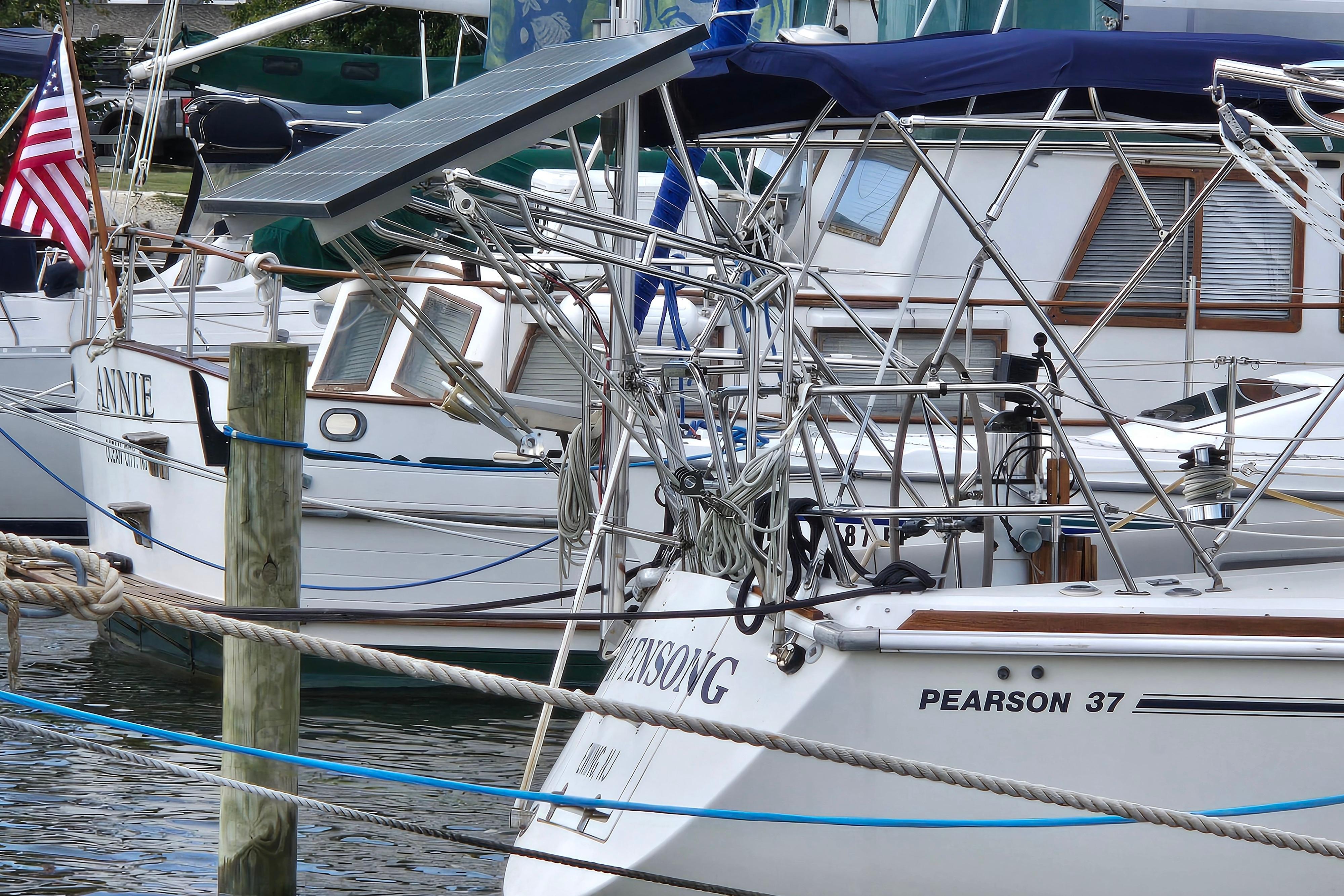 Pearson 37-2 sailboat from 1989 docked in a marina with solar panel.