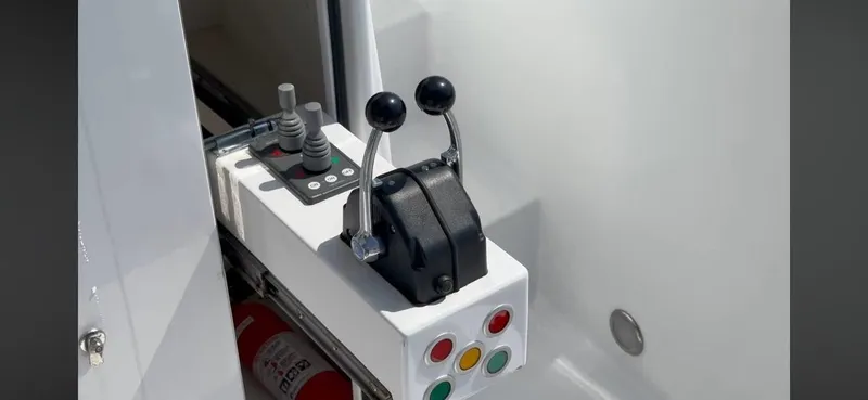 As Good As It Gets Yacht Photos Pics Control panel of 2002 Ocean Alexander 640 Pilothouse yacht with levers and buttons.