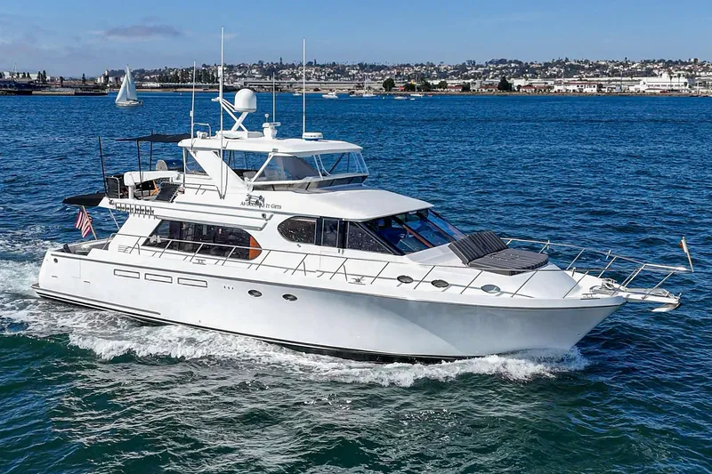 As Good As It Gets Yacht Photos Pics 2002 Ocean Alexander 640 Pilothouse yacht cruising on blue ocean waters.
