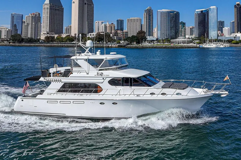 As Good As It Gets Yacht Photos Pics Ocean Alexander 640 Pilothouse yacht cruising near city skyline, 2002 model.