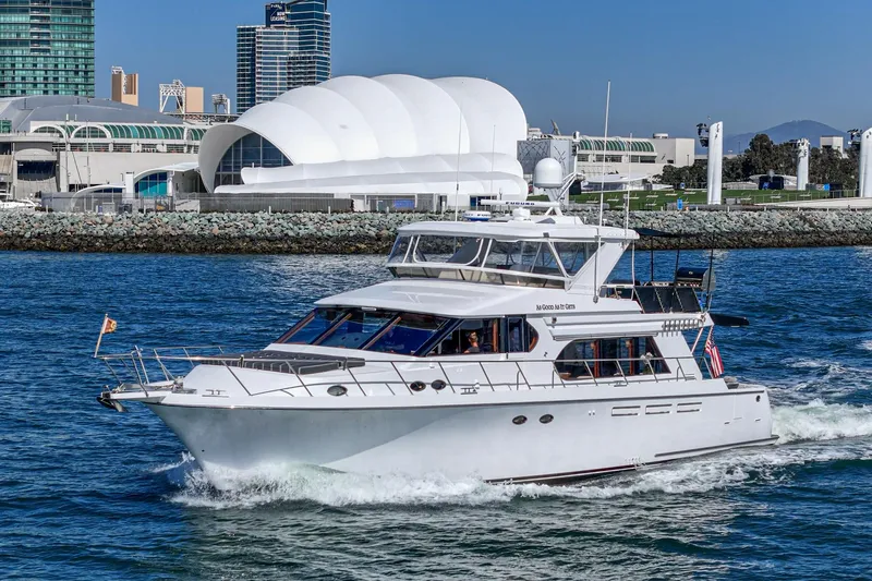 As Good As It Gets Yacht Photos Pics Ocean Alexander 640 Pilothouse yacht cruising near modern waterfront buildings, 2002 model.