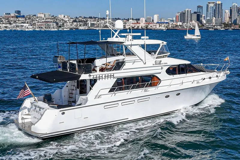 As Good As It Gets Yacht Photos Pics Luxury 2002 Ocean Alexander 640 Pilothouse yacht cruising near city skyline.