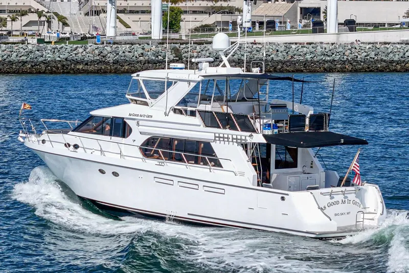 As Good As It Gets Yacht Photos Pics Ocean Alexander 640 Pilothouse yacht cruising near a rocky shoreline, 2002 model.