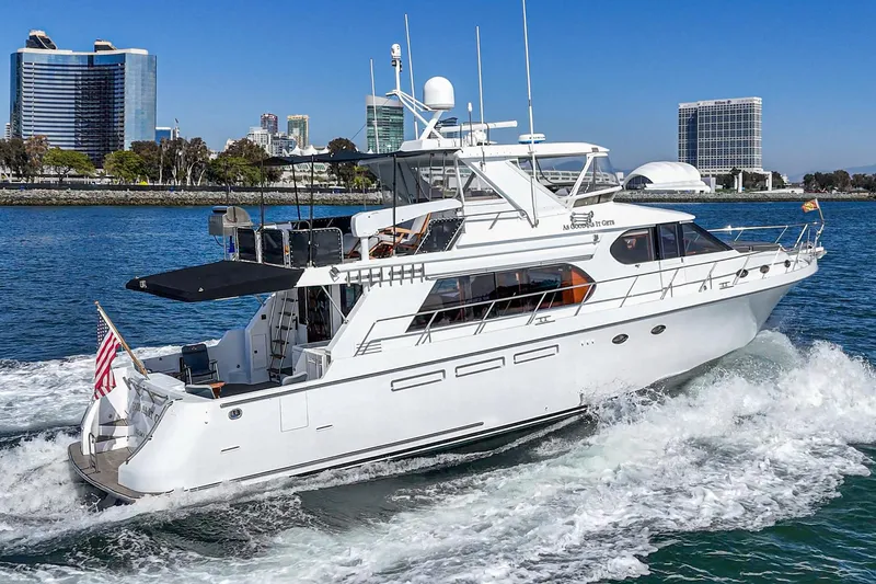 As Good As It Gets Yacht Photos Pics 2002 Ocean Alexander 640 Pilothouse yacht cruising near city skyline.