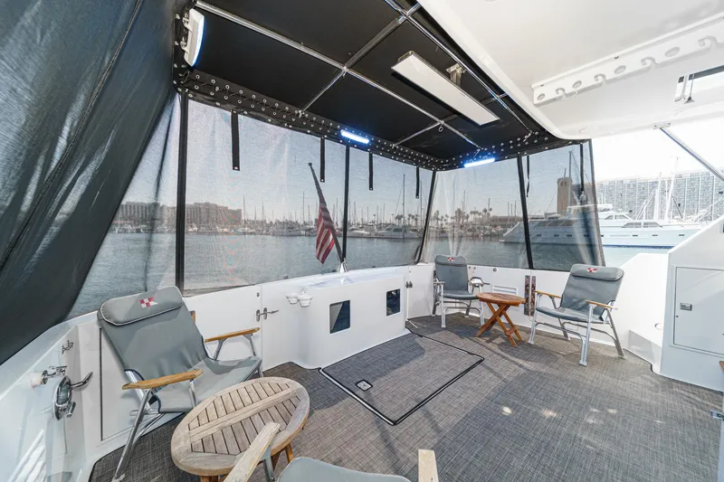 As Good As It Gets Yacht Photos Pics Spacious deck of 2002 Ocean Alexander 640 Pilothouse with seating and marina view.