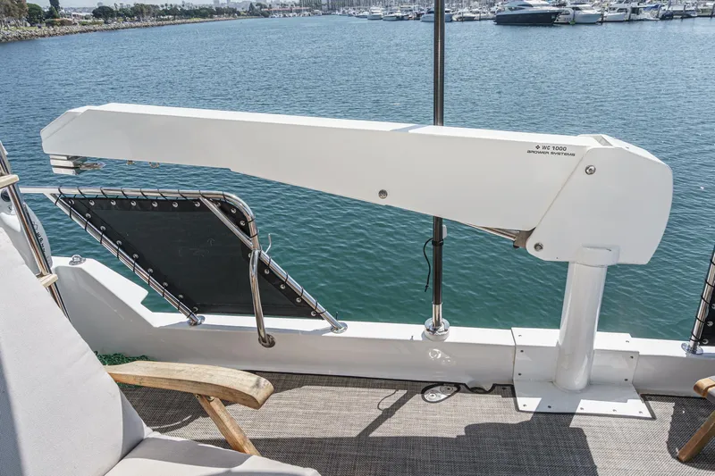 As Good As It Gets Yacht Photos Pics Deck of 2002 Ocean Alexander 640 Pilothouse with crane and seating, overlooking marina.