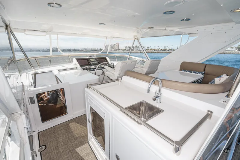 As Good As It Gets Yacht Photos Pics Luxurious 2002 Ocean Alexander 640 Pilothouse yacht interior with helm, seating, and kitchenette.