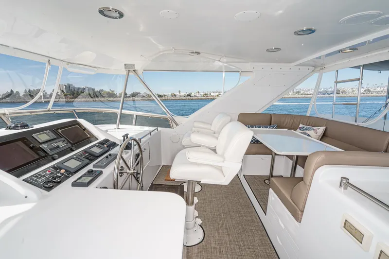 As Good As It Gets Yacht Photos Pics Luxurious 2002 Ocean Alexander 640 Pilothouse interior with helm and seating area.