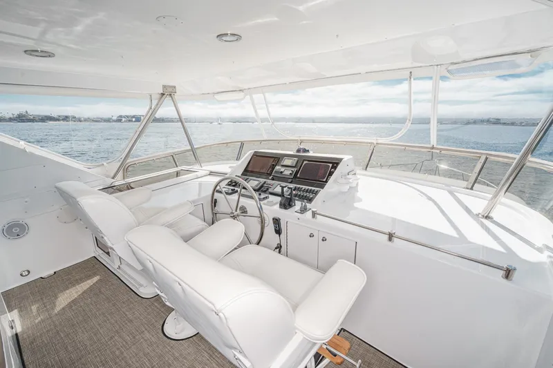 As Good As It Gets Yacht Photos Pics Pilothouse of 2002 Ocean Alexander 640, featuring modern navigation equipment and panoramic ocean views.