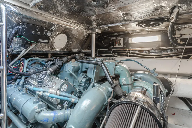 Miss Michelle Yacht Photos Pics Engine room of a 1996 Tiara Yachts 4300, showcasing mechanical components and wiring.