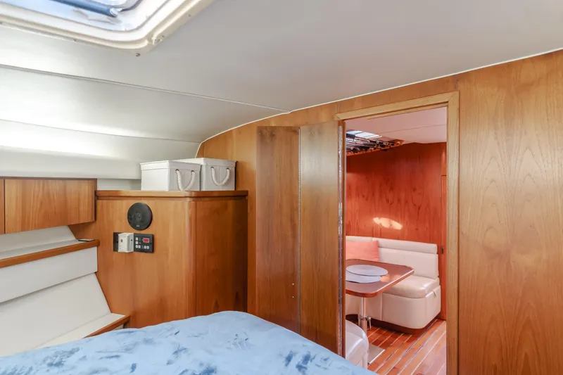 Miss Michelle Yacht Photos Pics 1996 Tiara Yachts 4300 interior with wood paneling and cozy seating area.