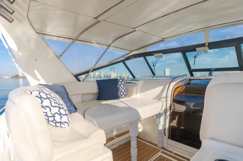 Miss Michelle Yacht Photos Pics Interior of 1996 Tiara Yachts 4300 with plush seating and ocean view.