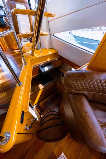 La More Yacht Photos Pics Luxurious interior of 2004 Sunseeker Manhattan 60 yacht with leather seating and wooden finishes.