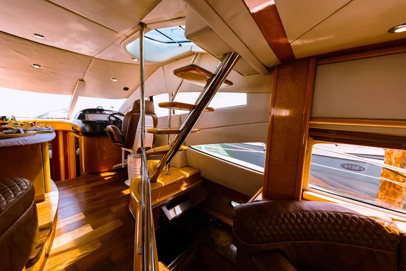 La More Yacht Photos Pics Luxurious interior of 2004 Sunseeker Manhattan 60 yacht with elegant wood finishes.