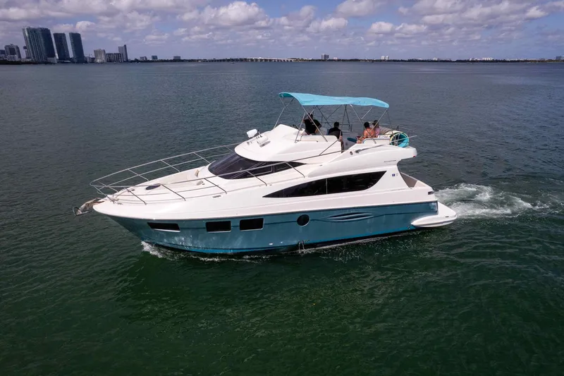  Yacht Photos Pics 2016 Silverton 43SB yacht cruising on open water under a clear sky.