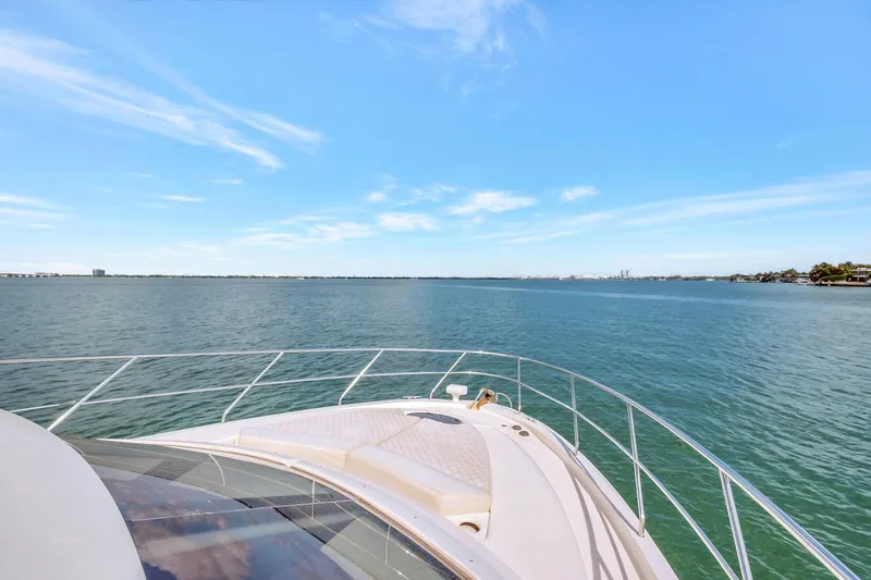  Yacht Photos Pics 2016 Silverton 43SB yacht cruising on open water under clear blue skies.