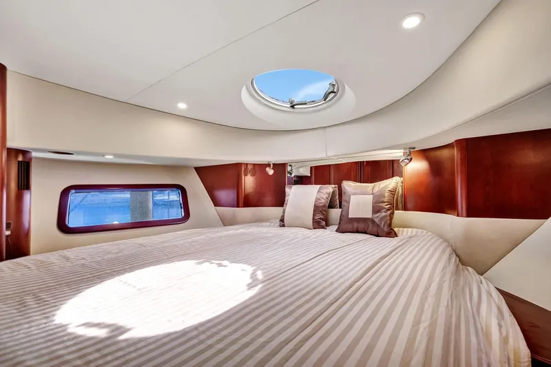  Yacht Photos Pics Luxurious bedroom interior of 2016 Silverton 43SB yacht with skylight and elegant bedding.