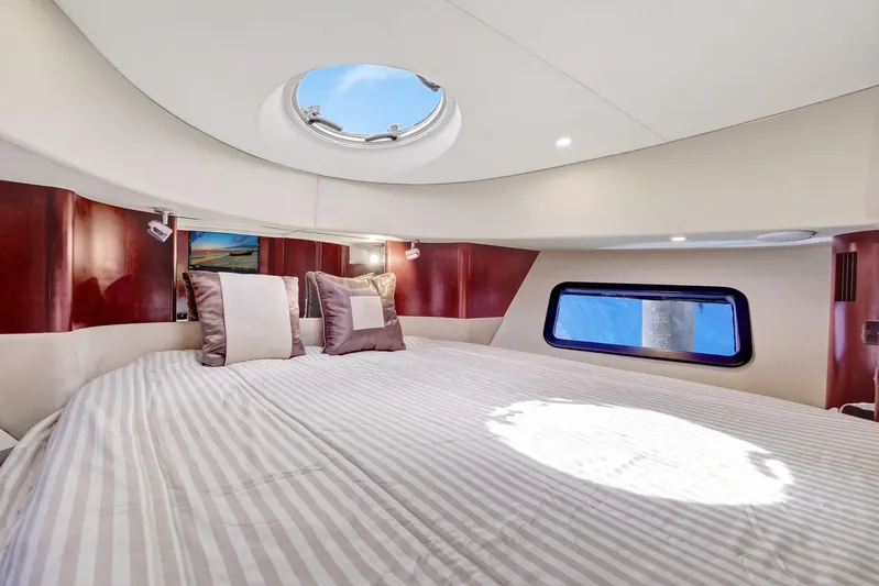  Yacht Photos Pics Luxurious bedroom interior of 2016 Silverton 43SB yacht with skylight and elegant bedding.