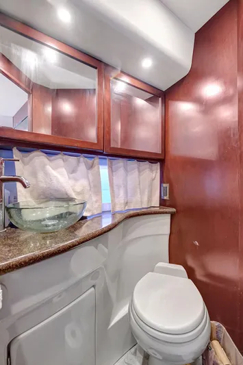 Yacht Photos Pics 2016 Silverton 43SB yacht bathroom with modern fixtures and wood cabinetry.