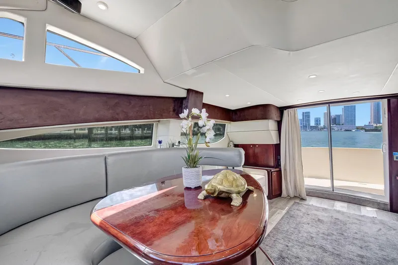  Yacht Photos Pics Luxurious 2016 Silverton 43SB yacht interior with elegant seating, table, and waterfront view.