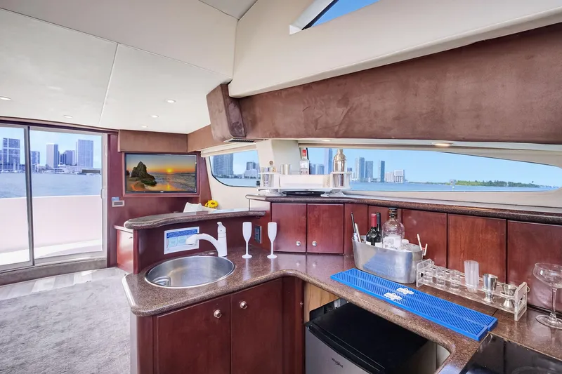  Yacht Photos Pics Luxurious interior of 2016 Silverton 43SB yacht with city skyline view.