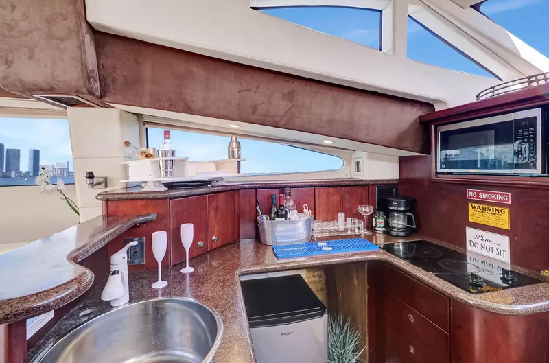  Yacht Photos Pics Luxurious 2016 Silverton 43SB yacht interior with kitchenette and modern amenities.