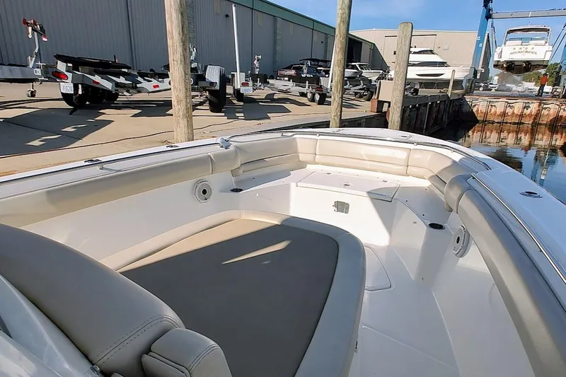  Yacht Photos Pics 2019 Boston Whaler 330 Outrage boat interior at a marina dock.